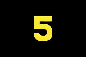 Arabic number 5 symbol of sponge rubber isolated on black background.