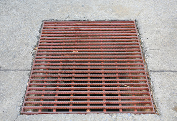 The metal sewer grate drainage for heavy rain.