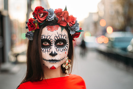 portrait of a girl in the city with a make-up, make-up for halloween, day of the dead, zombies. dead among us, ghost. walk of skeletons