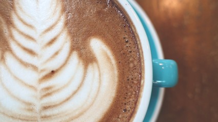 Close up of A cup of hot latte art or cappuccino coffee