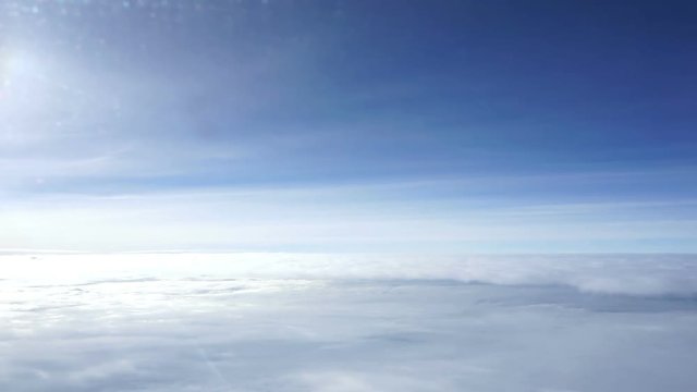 In flight flying above the clouds