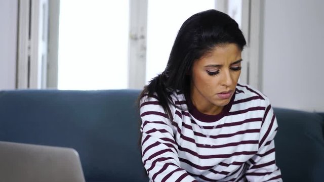 Attractive latin female single mother overwhelmed with home finances needing help paying expenses in living cots stress paying bills problem credit card debts mortgage and bad financial situation.
