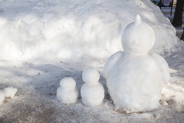 Snowman standing in winter landscape.A happy looking snowman on the frozen.Winter time - snowman in nature in cold day. © kanpisut