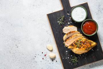 Chicken steak with sauces top view.