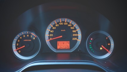 Naklejka premium Odometer Speed in car with orange light showing about gas running out of petrol sign