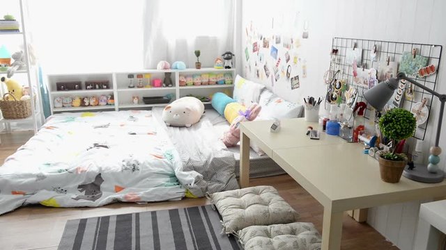 Empty bedroom with bed, table and furniture