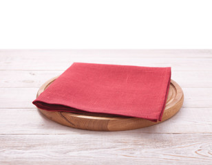 Pizza board, with napkin on wooden table isolated. Top view mockup