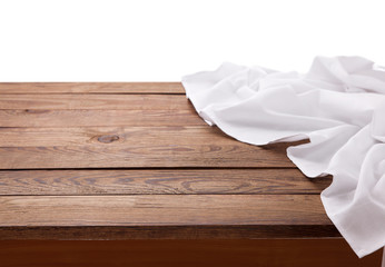 Kitchen towel on empty wooden table. Napkin close up top view mock up for design. Kitchen rustic background.