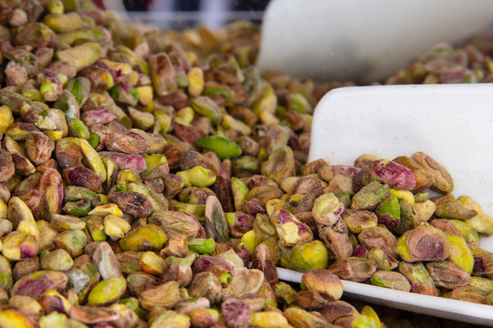 Pistachio Nuts Without Peel And White Plastic Scoop