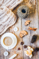 Christmas muffler with cup of cocoa wooden background top view