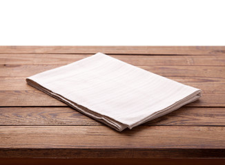 Wooden deck table with white napkin isolated on white. Kitchen background, product montage display. Mock up.