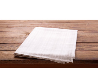 Wooden deck table with tablecloth isolated on white. Kitchen background, product montage display. Mock up.