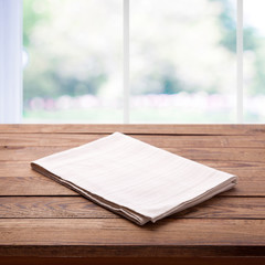 Napkin on the table and kitchen window blurred background