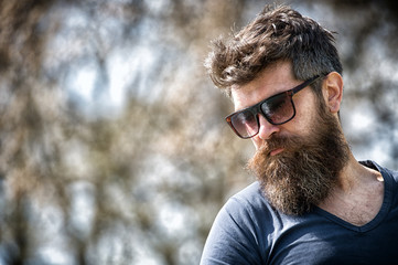 Macho with beard and mustache look confident brutal in sunglasses. Bearded guy strict face. Man...