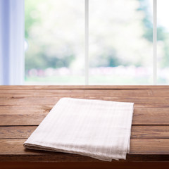 Napkin on the table and kitchen window blurred background