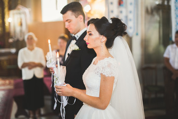 Wedding couple bide and groom get married in a church