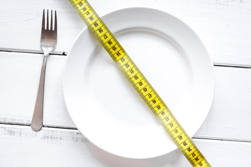concept diet and weight loss on wooden background top view