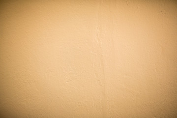 creamy, dark yellow wall texture background