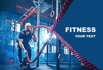 Men with battle rope battle ropes exercise in the fitness gym. CrossFit concept. gym, sport, rope, training, athlete, workout, exercises concept - obrazy, fototapety, plakaty