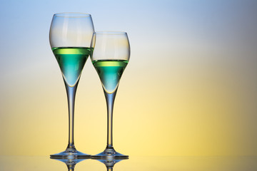 two glasses with cocktails