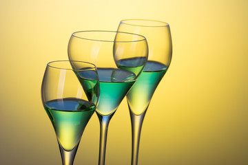 three glasses with cocktails