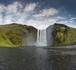 Iceland waterfall Skogafoss in Icelandic nature landscape. Famous tourist attractions and landmarks destination in Icelandic nature landscape on South Iceland.