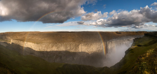 Panoramic shot of the Gullfoss Falls with a beautiful rainbow, Iceland