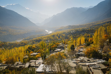 Aerial view landscape of autumn colorful Hunza valley in the morning with Karakoram mountain range in the background. Gilgit-Baltistan, Pakistan.