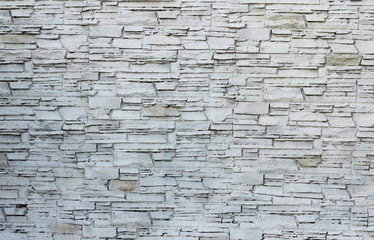 Background of stone wall texture photo. White gray bricks.