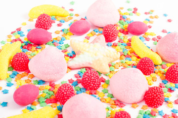 Fototapeta na wymiar Colorful candy, lollipop and sweets isolated on white background. Top view. Selective focus.