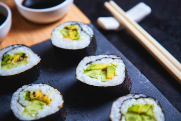 Vegan sushi rolls made with nori algae, sushi rice, cucumbers and avocado