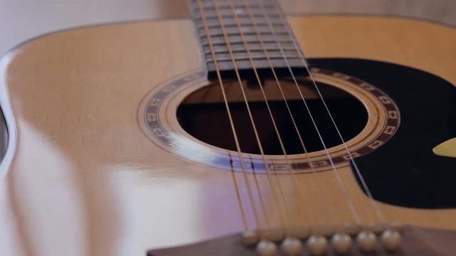 Close up shot of acoustic guitar on the stage
