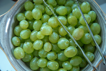 Vintage in a small gbowl . bowl of grapes . Heap of choped cubes of grape in bowl