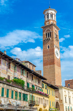 Italy, Verona, Piazza delle Erbe, view to historical facades and Torre dei Lamberti