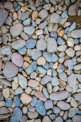 Sea pebbles. Small stones gravel texture background.Pile of pebbles, thailand.Color stone in background.