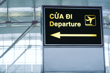 Flight information, arrival and departure board at the airport with English and Vietnamese language