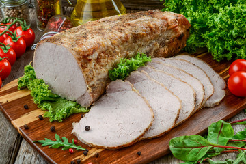 Delicious spicy meat. Spicy meat baked with chili pepper. Piece of baked meat with spices and vegetables on the table.