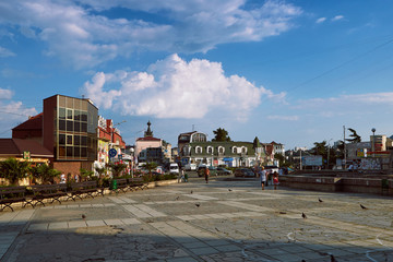 View of central Sovetskaya Square in the resort Alushta city in Crimea. Sunday. A blue sky.
