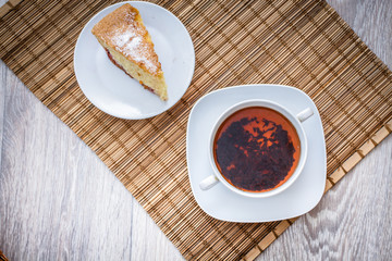 freshly baked biscuit plum cake and a hot cup of tea