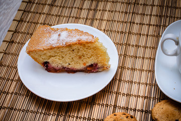 Large shot of sponge cake plum pie.