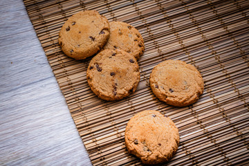 Chocolate cookies on the straw bedding.