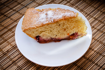 a slice of sponge cake on round white plates