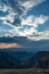 panoramic view of green valley with stones in Durmitor massif, Montenegro