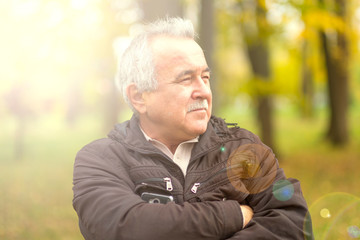 Portrait of an elderly man in the park.