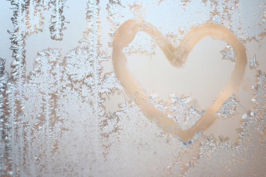 heart of frost heart on window. winter miracle