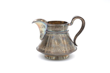 Vintage silver jug on white background. In isolation.