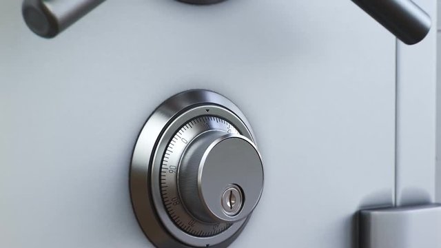 Mechanical dial combination safe full of gold bars mounted on a white wall.