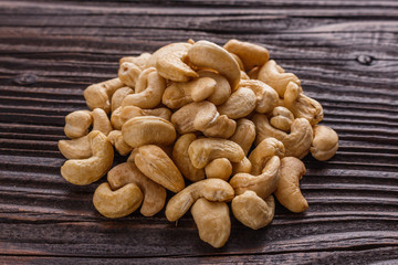 cashew nuts on a rustic wooden background