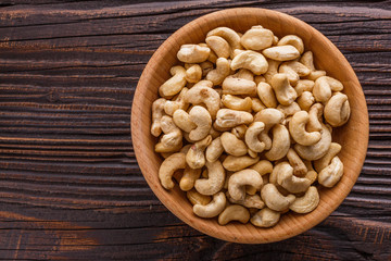 cashew nuts on a rustic wooden background
