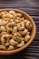 cashew nuts on a rustic wooden background